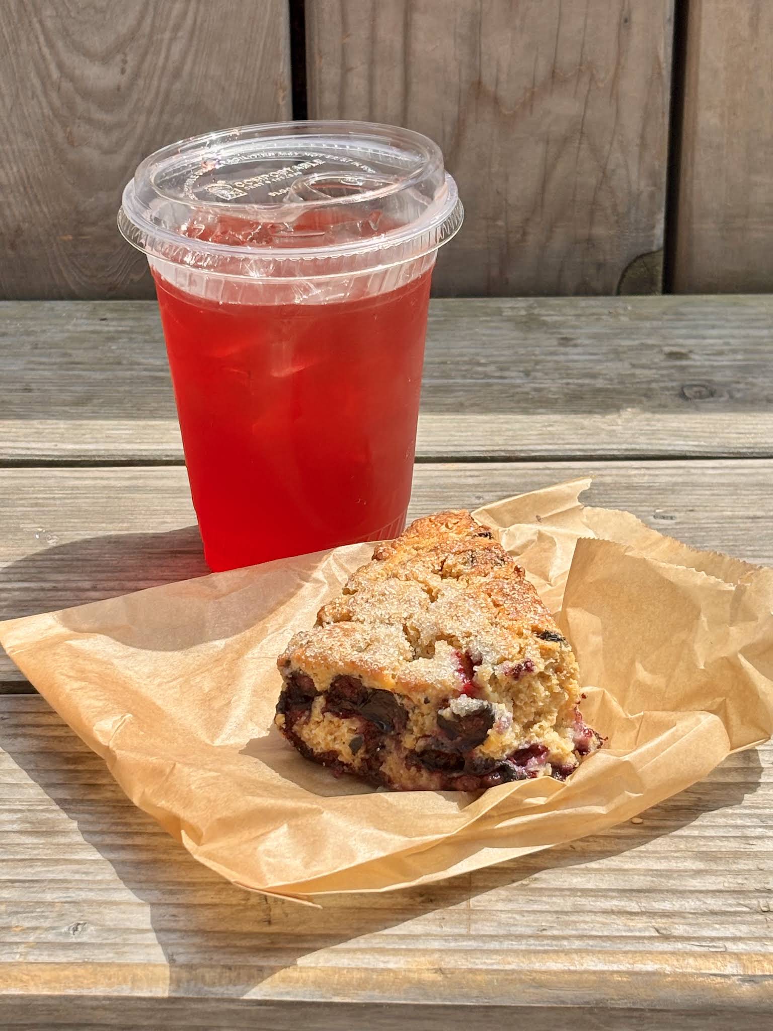 A berry scone with pink lemonade