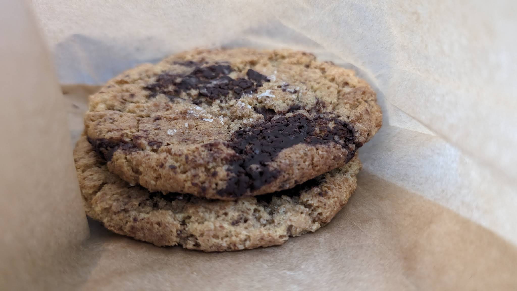 Chocolate chip cookies in a paper bag