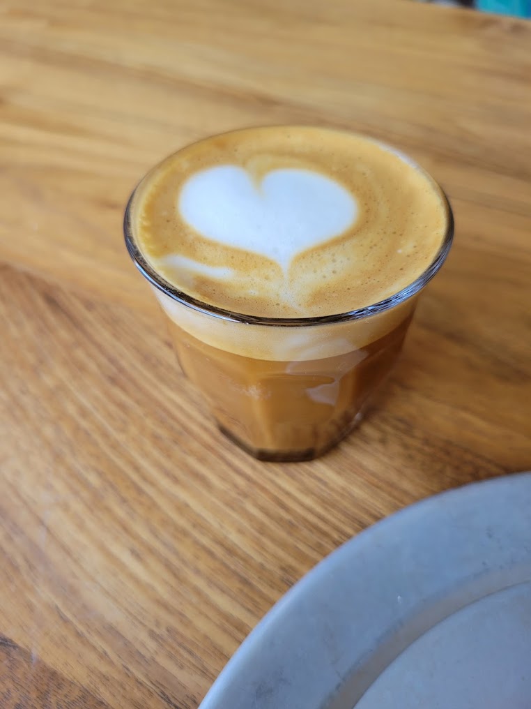 A cortado with latte art